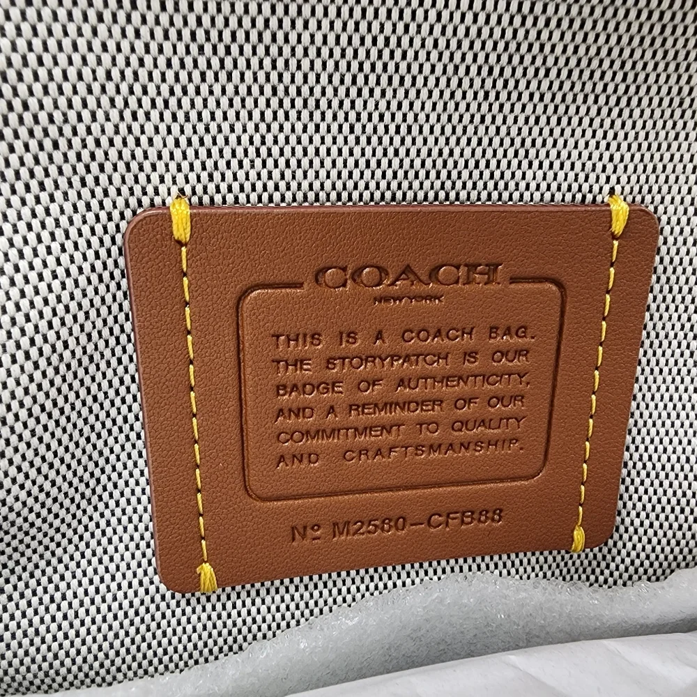 Coach Black Round Crossbody with Gold Frame